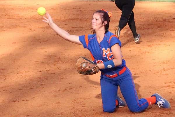 Chaney Stearns, in a game earlier this season, throws to first from her knees for the out.