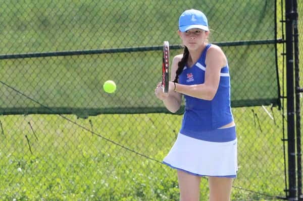 Elizabeth Padgett with a return against St. Mary's Olivia Ellison in her round one win at the Regional Tournament.