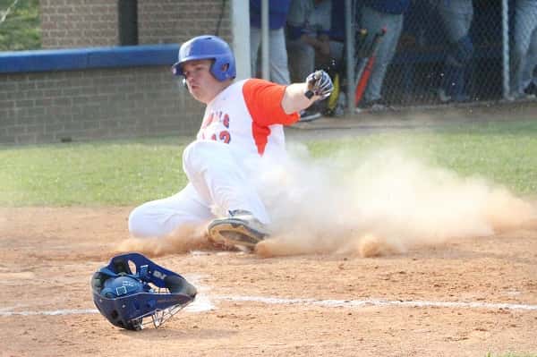 Cody Clark slides into home in the third inning to put the Marshals up 2-1 over Graves County.