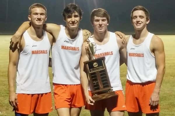 The 1st place 4 x 400 relay team of (left to right) Nathan Solomon, Austin Shackleford, Robert Blankenship and Jacob Carnine proudly hold the boy's 1st place team trophy from Friday's Area 1 Championships.