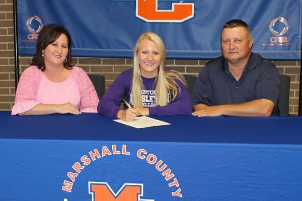 Kara Kelley, joined by her parents Vanessa and Robbie Kelley, signed to run track for Kentucky Wesleyan College.