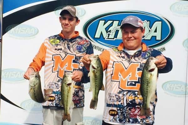 Colton Story (left) and Peyton Porter showing off their fish from Friday's first day of the KHSAA State Bass Fishing Tournament at Kentucky Dam Marina.