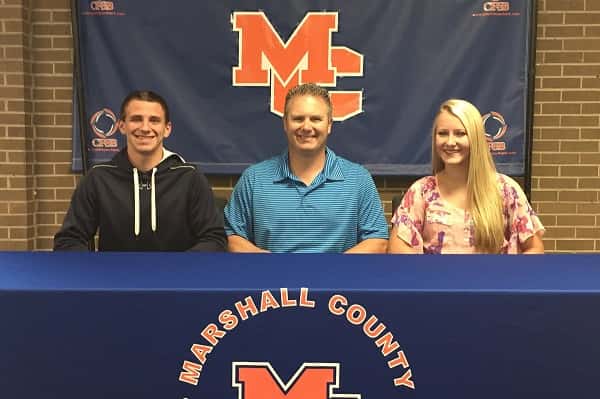 Lane Roberts and Kara Kelley along with Marshall County Athletic Director Jeff Stokes.