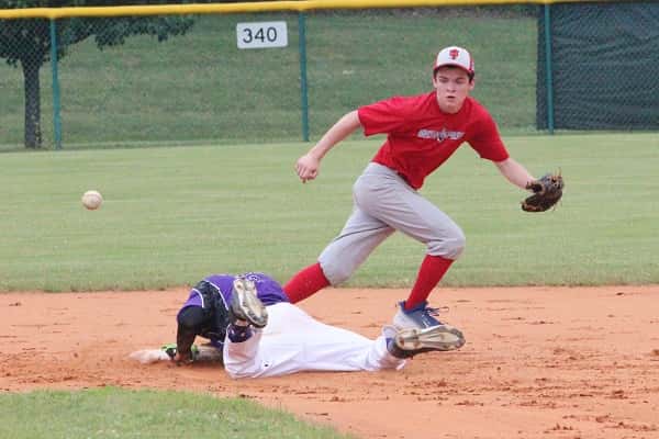 Blaine Bizzle moved to grab the ball as the Dawson County runner takes second base.
