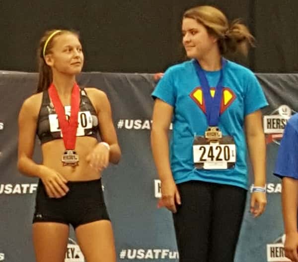 Keagin Brooks (left) on the podium in 2nd in the 13-14 javelin throw.
