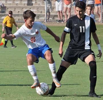 Seth Stader and Murray's Gustavo Leon battle for control of the ball.