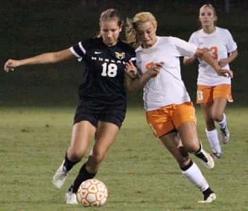 Kayla Travis and Murray's Lily Ramey focused on the ball.