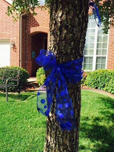 A Facebook photo shows a ribbon around a tree in support of law enforcement.
