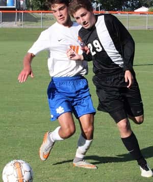 Seth Stader battling Murray's Hal Bogard in the 2nd game of the season against Murray. The Marshals won that game 5-4.