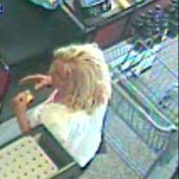 surveillance-video-reportedly-shows-the-next-customer-a-woman-with-curly-shoulder-length-blonde-hair-picking-up-the-wallet-with-a-bag-of-purchases
