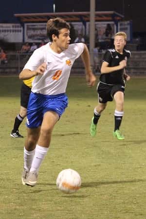 Mid-fielder Cameron Ives moving the ball forward for the Marshals.