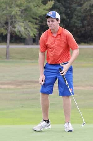 Quinn Eaton, after his par on the 18th hole, realizing he's the 2015 1st Region medalist.