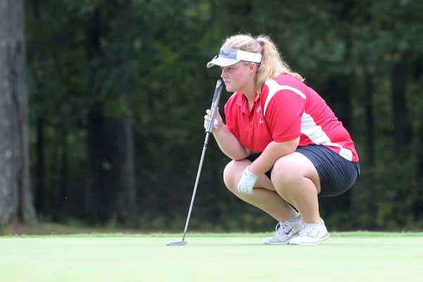 Maddie Ortt studies her putt on the 17th green at Tuesday's 1st Region Tournament.