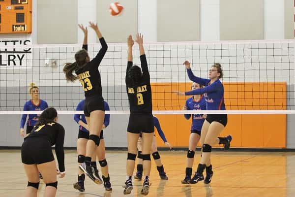 Lady Marshal Ragan Harris with a hit over Murray blockers in Tuesday home game.