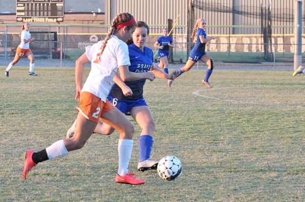 Brittany Kimbro dribbling the ball downfield against Graves County in the 2nd District semi-final game. Kimbro scored the Lady Marshals only goal.