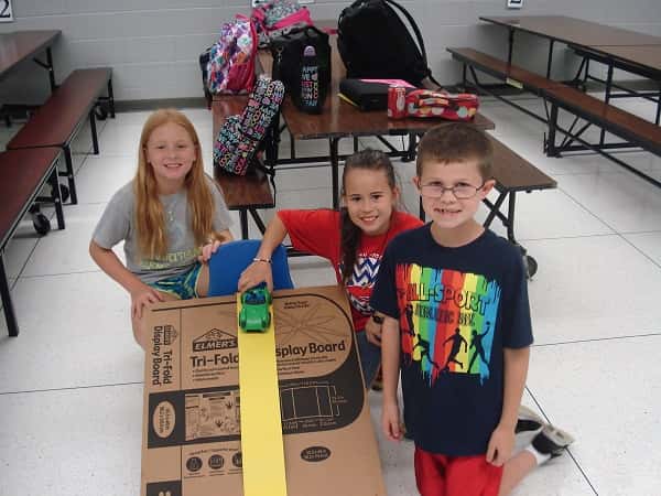 Jonathan 4-Hers getting ready to test run their car on Motion Commotion track
