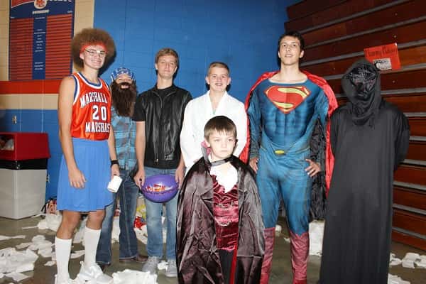 These boy's basketball team players headed up the 'Mummy Making' station at Monday's Haunted House of Hoops.