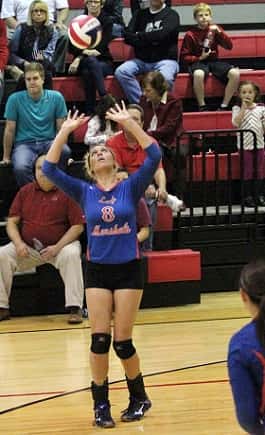 Paige Henson sets the ball for the Lady Marshal hitters.