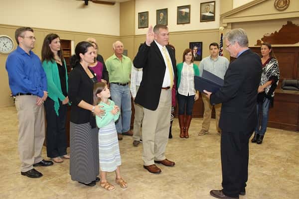 Kevin Neal was surrounded by friends and family as he was sworn in by District Judge Jack Telle as Marshall County's Judge Executive.