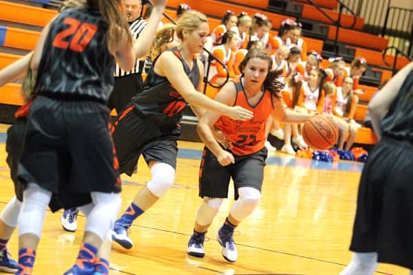 Junior Hannah English with the ball guarded by senior Nikki Fehrenbacher during the Lady Marshals 'Meet the Marshals' scrimmage.