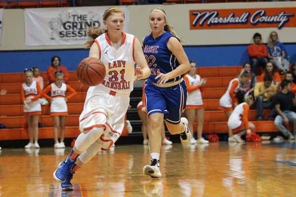 Miyah Davis bringing the ball down the court for the Lady Marshals.