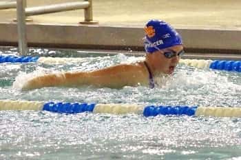 Shelbi Spencer swimming the butterfly event on Monday at PAC.