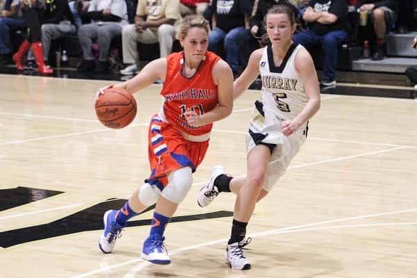Nikki Fehrenbacher is guarded step for step by Murray's Macey Turley in the Lady Marshals loss last week to the Lady Tigers.