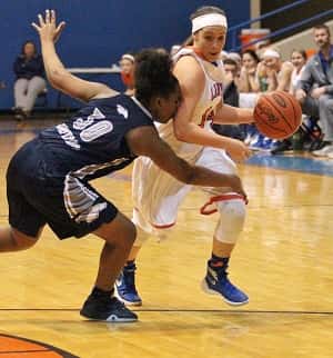 Lexee Miller works around a Moore defender in Monday's 58-15 win.