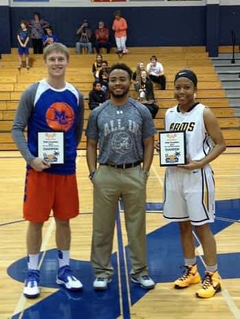 D.J. Pigg won the 3-point skills competition on Monday with 23 of 30 points in the final round. Pictured here with the girl's 3-point contest winner, Rutherford High School's Tiara Bell and Arnold boy's head coach Bobbie Britton.