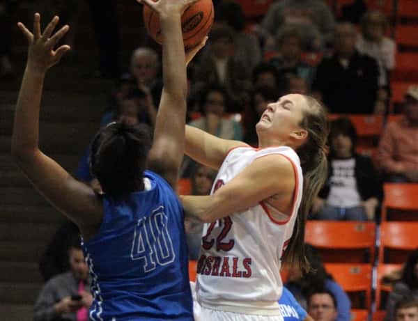 Briley English attempts a shot over the out-stretched arms of Tilghman's Tyese Anderson.