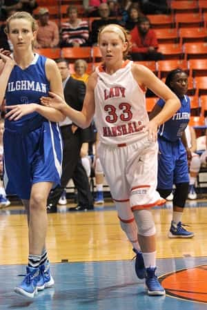 Kat Howard staying close to Tilghman's Kathryn Story in the Lady Marshals win Friday.