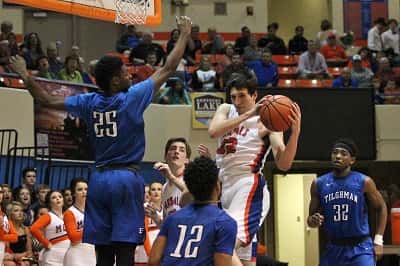 Matthew French snags a rebound away from Tilghman's Jerome Reed (25) and Sayveon McEwen (12).