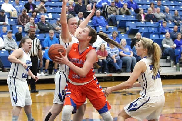 Hannah Langhi led the Lady Marshals with 14 points, guarded here by Cassidy Sheppard. Also pictured Dana Adkins (42) and Lyndi Qualls (33).