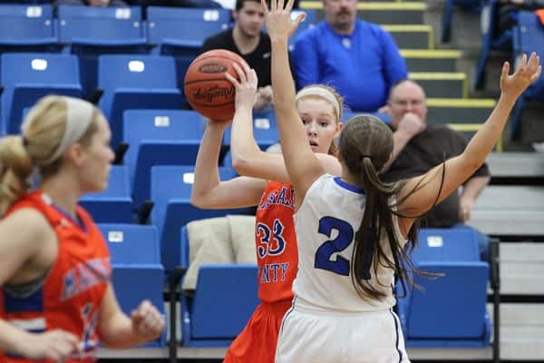 Kat Howard, covered up by Graves County's Bailey Cartwright.