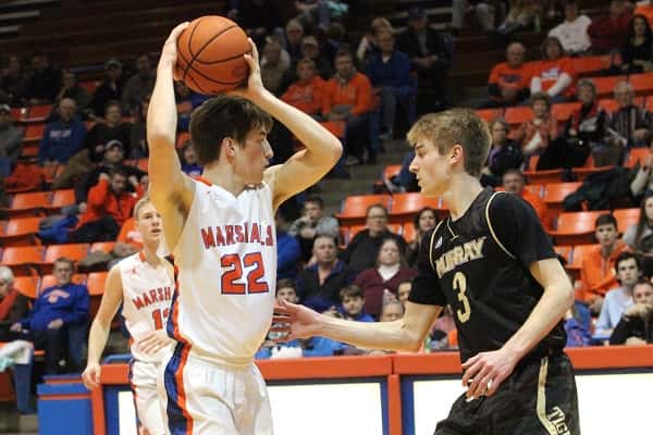 Skyler Smith, guarded by Preston English, scored 8 points in the Marshals overtime loss to Murray.
