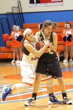 Lexee Miller and Alexis Burpo battle for control of the ball.