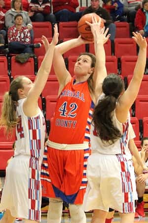 Hannah Langhi fought off defenders to score 21 points in the Lady Marshals win.