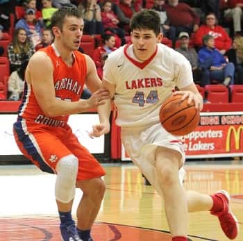 Dawson Jolley guarding Payton Johnson in Marshall County's 4th District semi-final win over Calloway County.