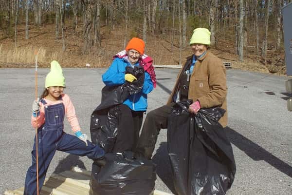 Terry Tillson (right), her mother Rose Tillson (center) and grand-daughter Ali Barrett, doing their part in a previous clean-up day at the park.