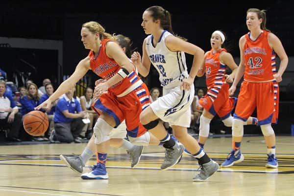 Nikki Fehrenbacher kept the ball away from Graves County's Danielle Waggoner in Monday's opening round of games in the 1st Region Tournament at Murray State's CFSB Center.