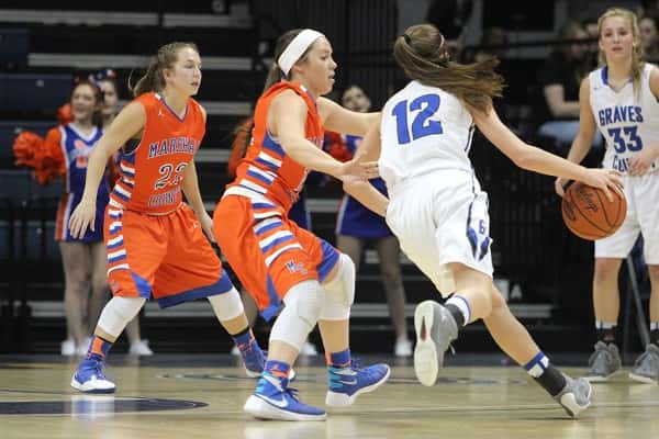 Lexee Miller guarding Danielle Waggoner in the Lady Marshals 44-33 loss to Graves County.