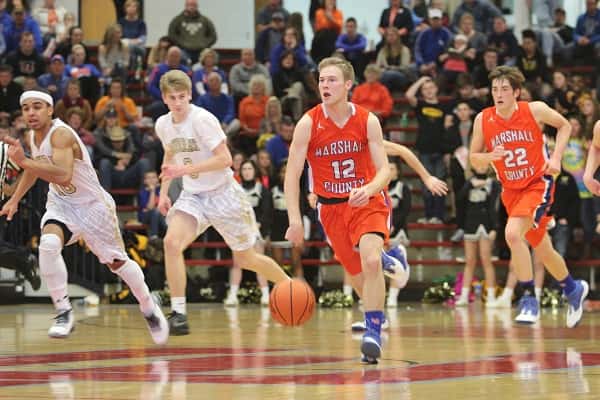 Senior D.J. Pigg headed down the court with the ball in the Marshals 4th District Tournament Championship game against Murray High.