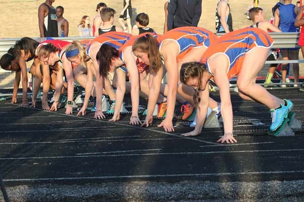 Five Lady Marshals in the blocks for the start of a heat of the 100 meter dash at last week's Marshall County All-Comers meet.