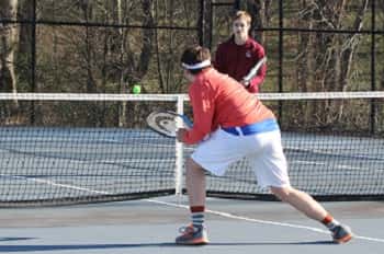 Tucker Lovett earned a point on this shot in his doubles match with teammate Charlie Reid.