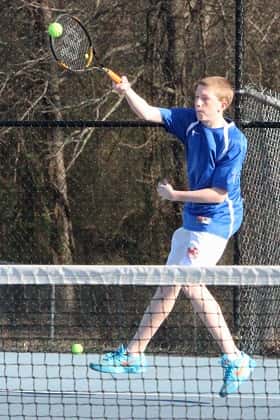 Kaleb Willie returning a serve in his doubles match Tuesday against McCracken County.