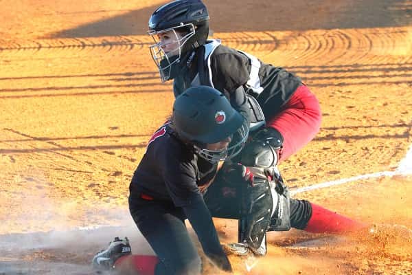Mayfield's catcher made the tag at the plate on Christian Fellowship's Emily Nelson for the out.