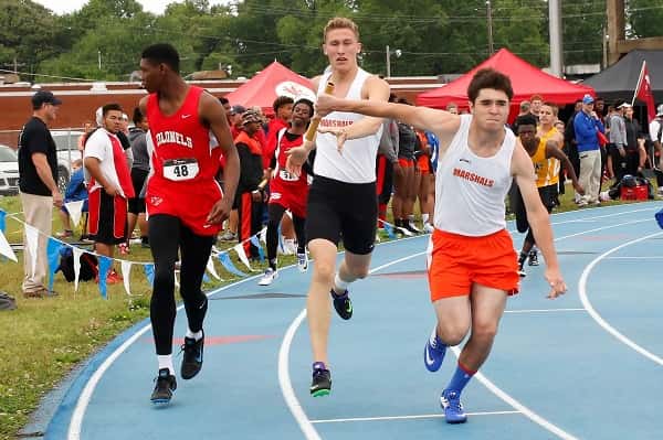 Jackson Brown hands off to Will McGee in a relay event Friday at McCracken County. All photos courtesy of Steve Feeney (www.stevefeeney.photography)