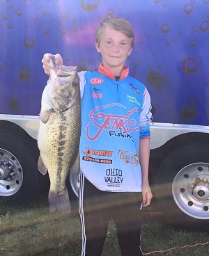 Miles McManus shows off the 6-15 bass that won him the Biggest Bass Award.