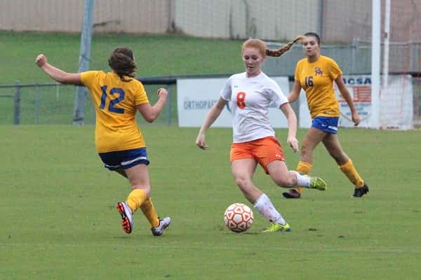 Kat Howard working the ball in the midfield away from St. Mary players.