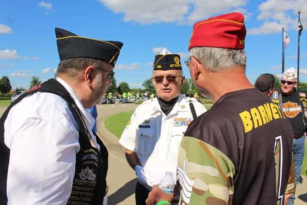 Calvert City Post 236 Commander Bob Zirkle Jr. meets with Bob Sussan, Legacy Run chief road captain (left), and American Legion National Commander Dale Barnett.
